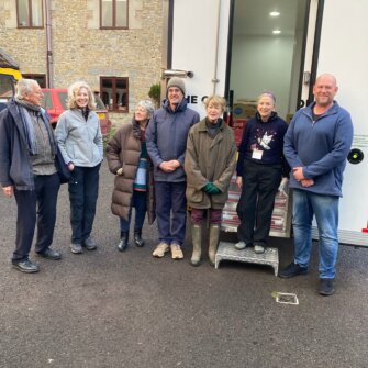 Quantock Foodbank Team in front of Electric Mobile Pantry